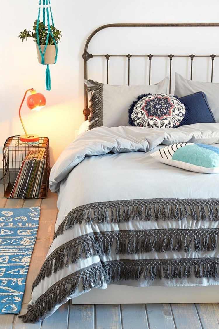 bohemian-style-bedroom-white-metal-bed-black-runner-hall-floor-pillow-blue-night-lamp