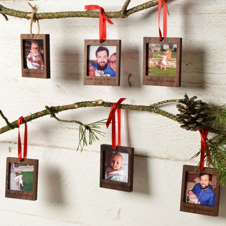 polaroid-photos-decoration-christmas-fir-branches-pine-cones-wood-frame