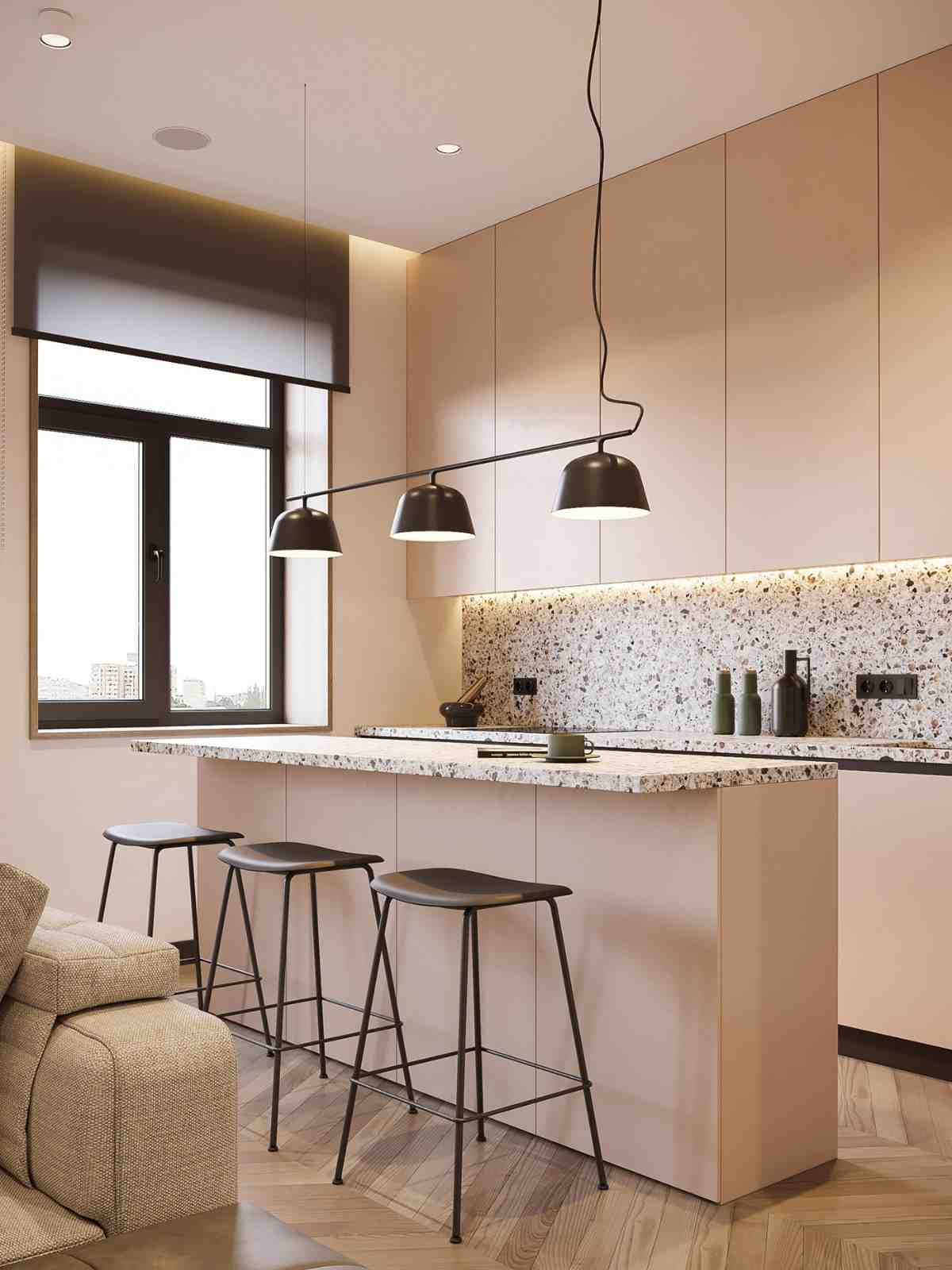 appertmen de design com uma kitchenette composta por uma ilha de cozinha com luzes negras pendentes e bancos de bar